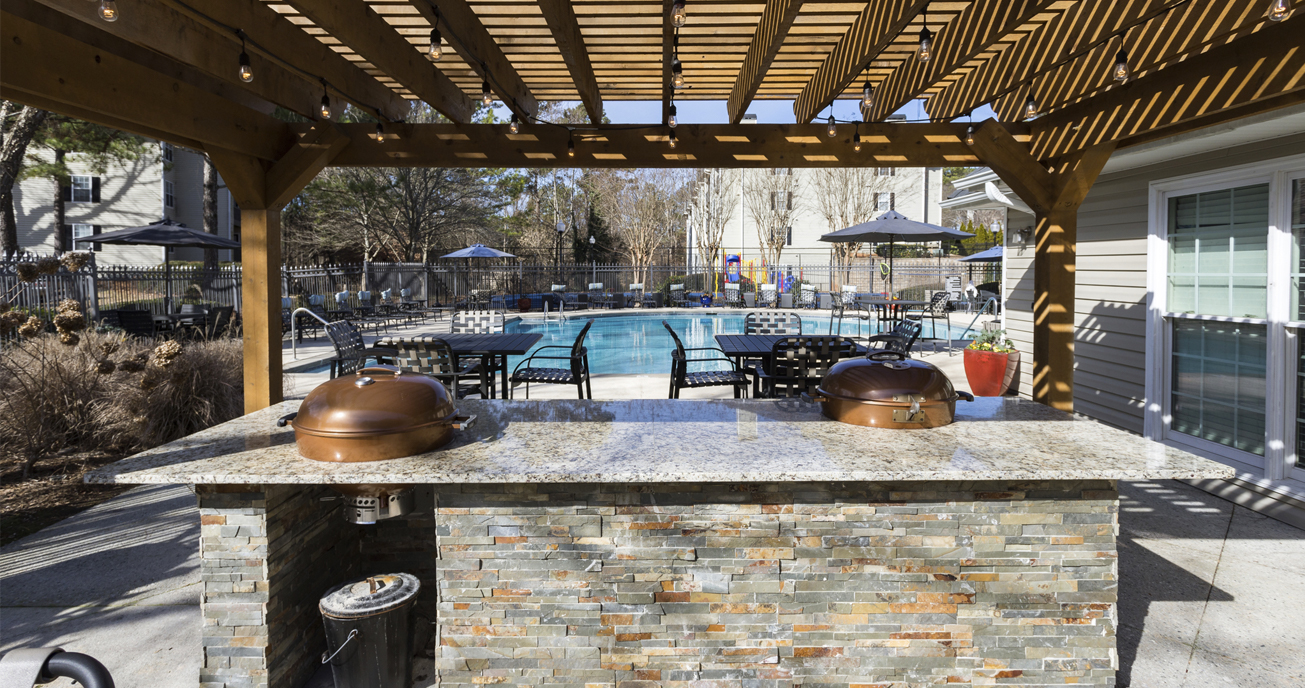 outdoor patio with grill and pool, river vista, atlanta ga