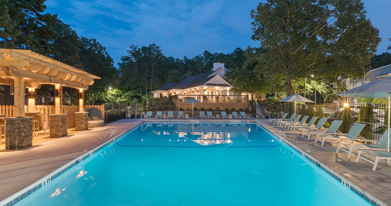 outdoor pool with clubhouse and chairs, 550 Abernathy, atlanta ga